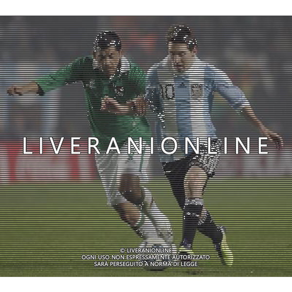 (110702) -- LA PLATA, July 2, 2011 -- Lionel Messi (R) of Argentina fights for the ball with Walter Flores of Bolivia during the opening match of Copa America 2011 in La Plata, Argentina, on July 1, 2011. The two teams played to a 1-1 tie. Claudio Cruz) (djj)