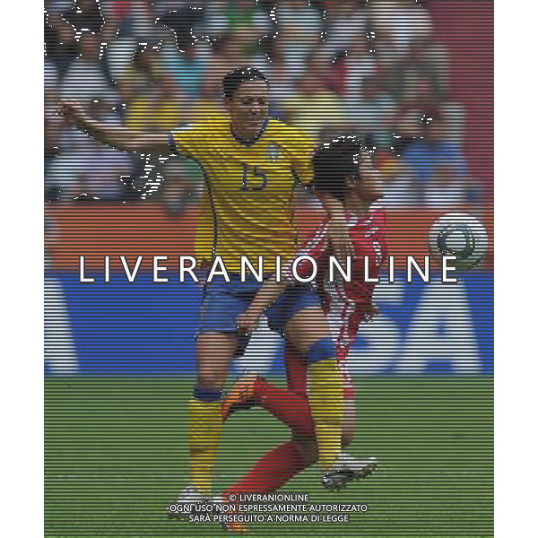 (110702) -- AUGSBURG, July 2, 2011 -- Therese Sjogran(L) of Sweden vies with Kim Su Gyong of DPRK during the second round Group C match between DPRK and Sweden at the FIFA Women\'s World Cup Germany 2011 in Augsburg, Germany, July 2, 2011. Li Jundong)(wll) ©PHOTOSHOT/Agenzia Aldo Liverani Sas - ITALY ONLY: COREA - SVEZIA Campionati Mondiali di calcio femminile FIFA Cup Germania 2011