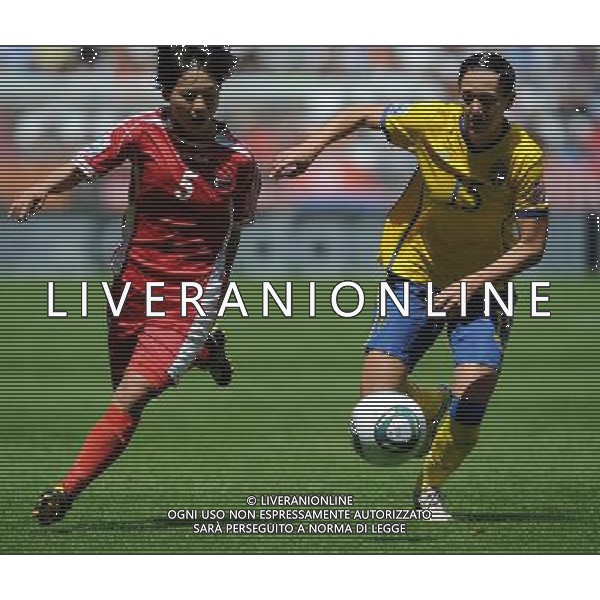 (110702) -- AUGSBURG, July 2, 2011 -- Therese Sjogran(R) of Sweden vies with Song Jong Sun of DPRK during the second round Group C match between DPRK and Sweden at the FIFA Women\'s World Cup Germany 2011 in Augsburg, Germany, July 2, 2011. Li Jundong)(wll) ©PHOTOSHOT/Agenzia Aldo Liverani Sas - ITALY ONLY: COREA - SVEZIA Campionati Mondiali di calcio femminile FIFA Cup Germania 2011