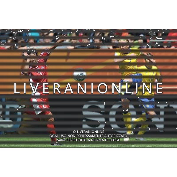 (110702) -- AUGSBURG, July 2, 2011 -- Sara Larsson(R) of Sweden vies with Yun Hyon Hi of DPRK during the second round Group C match between DPRK and Sweden at the FIFA Women\'s World Cup Germany 2011 in Augsburg, Germany, July 2, 2011. Li Jundong)(wll) ©PHOTOSHOT/Agenzia Aldo Liverani Sas - ITALY ONLY: COREA - SVEZIA Campionati Mondiali di calcio femminile FIFA Cup Germania 2011
