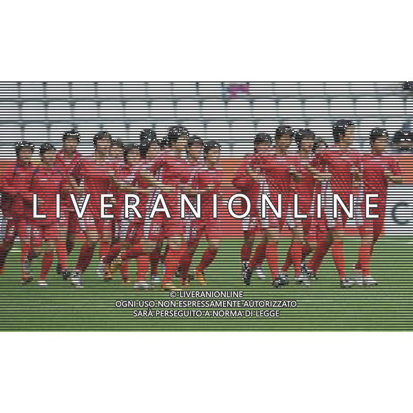 (110702) -- AUGSBURG, July 2, 2011 -- Players of DPRK warm up before the second round Group C match between DPRK and Sweden at the FIFA Women\'s World Cup Germany 2011 in Augsburg, Germany, July 2, 2011. Li Jundong)(wll) ©PHOTOSHOT/Agenzia Aldo Liverani Sas - ITALY ONLY: COREA - SVEZIA Campionati Mondiali di calcio femminile FIFA Cup Germania 2011