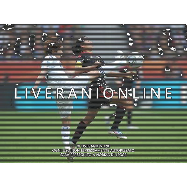 (110701) -- LEVERKUSEN, July 1, 2011 -- Mizuho Sakaguchi (L) of Japan vies with Stephany Mayor of Mexico during the second round Group B match between Japan and Mexico at the FIFA Women\'s World Cup Germany 2011 in Leverkusen, Germany, July 1, 2011. Japan won 4-0.Wu Wei)(wll) ©PHOTOSHOT/Agenzia Aldo Liverani Sas - ITALY ONLY: GIAPPONE - MESSICO Campionati Mondiali di calcio femminile FIFA Cup Germania 2011