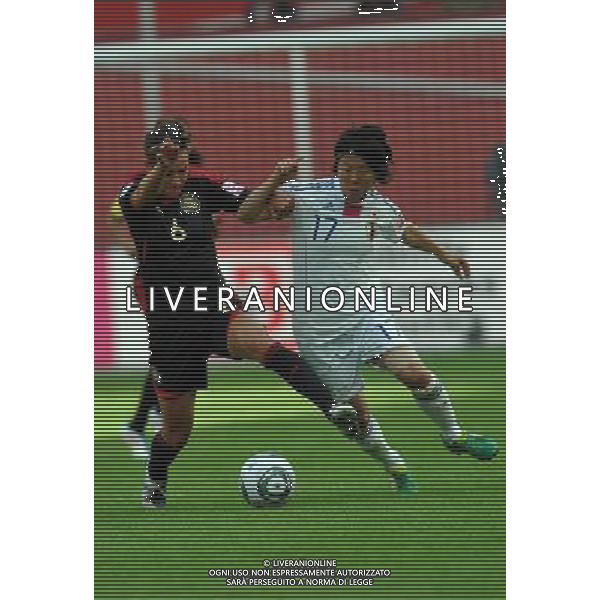 (110701) -- LEVERKUSEN, July 1, 2011 -- Yuki Nagasato(R) of Japan vies with Natalie Garza of Mexico during the second round Group B match between Japan and Mexico at the FIFA Women\'s World Cup Germany 2011 in Leverkusen, Germany, July 1, 2011. Ma Ning)(wll) ©PHOTOSHOT/Agenzia Aldo Liverani Sas - ITALY ONLY: GIAPPONE - MESSICO Campionati Mondiali di calcio femminile FIFA Cup Germania 2011