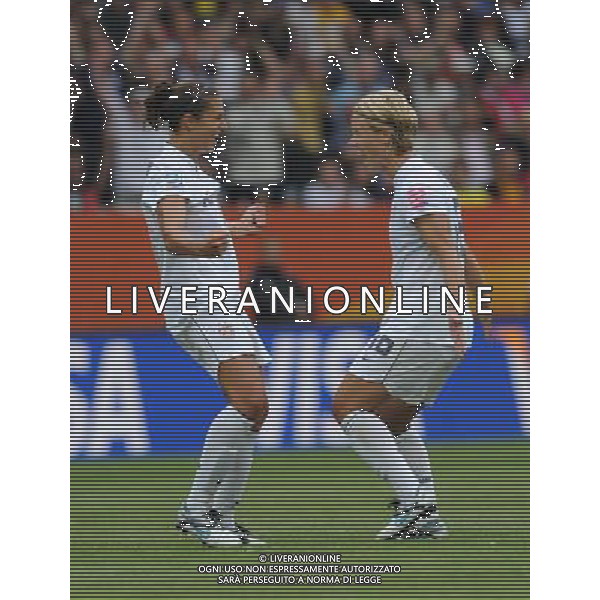 (110702) -- SINSHEIM, July 2, 2011 () -- U.S. player Carli Lloyd (L) celebrates her goal during the second round Group C match between the United States and Colombia at the 2011 FIFA Women\'s World Cup in Sinsheim, Germany, July 2, 2011. The United States beat Colombia 3-0. (/Xu Liang) (zw) ©PHOTOSHOT/Agenzia Aldo Liverani Sas - ITALY ONLY: COLOMBIA - STATI UNITI USA Campionati Mondiali di calcio femminile FIFA Cup Germania 2011