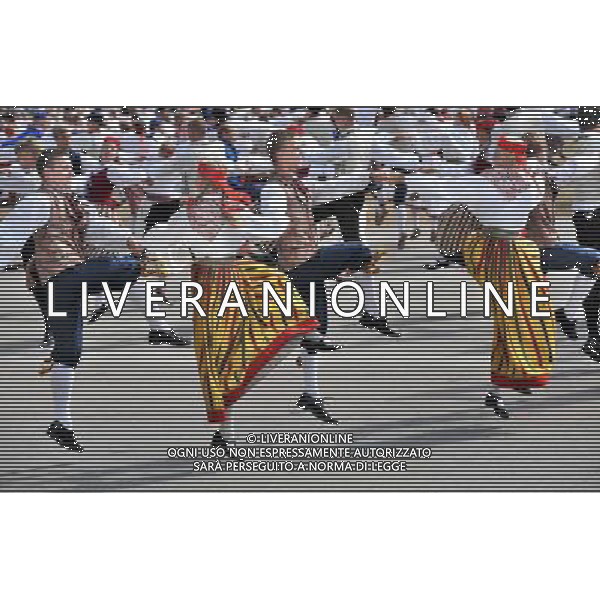 (110702) -- TALLIN, July 2, 2011 -- Young people in traditional clothes perform during the Youth Dance and Song Festival in suburb of Tallinn, capital of Estonia, July 1, 2011. The triennial festival, one of the country\'s biggest traditional cultural celebrations, kicked off on Friday, attracting tens of thousands of young performers and visitors from all over the country. (lyi)