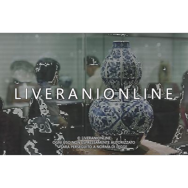 (110703) -- BEIJING, July 3, 2011 () -- Photo taken on July 3, 2011 shows a blue and white porcelain bottle created in Yuan Dynasty (1271-1368) in an exhibition in Beijing, capital of China. The exhibition which kicked off on Sunday displayed tens of masterpieces of blue and white porcelain owned by oversea collectors. (/Li Fangyu) (zn)