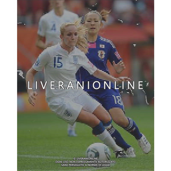 (110706) -- AUGSBURG, July 6, 2011 () -- Sophie Bradley (L) of England competes during the 3rd round Group B match between England and Japan at the FIFA Women\'s World Cup Germany 2011 in Augsburg, Germany, July 5, 2011. (/Li Jundong)