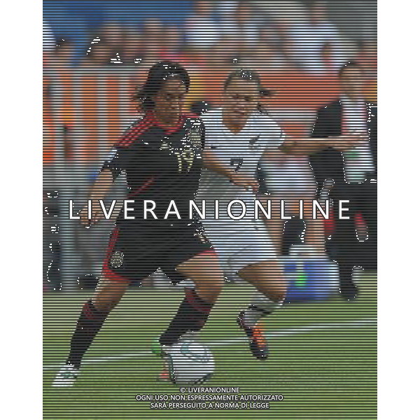 (110706) -- SINSHEIM, July 6, 2011 () -- Monica Ocampo (L) of Mexico vies with Ali Riley of New Zealand during their 3rd round Group B match at the FIFA Women\'s World Cup Germany 2011 in Sinsheim, Germany, July 5, 2011. (/Xu Liang)(lm)
