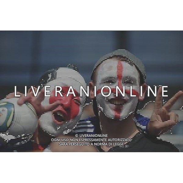 (110706) -- AUGSBURG, July 6, 2011 () -- Supporters pose together before the 3rd round Group B match between England and Japan at the FIFA Women\'s World Cup Germany 2011 in Augsburg, Germany, July 5, 2011. (/Li Jundong)