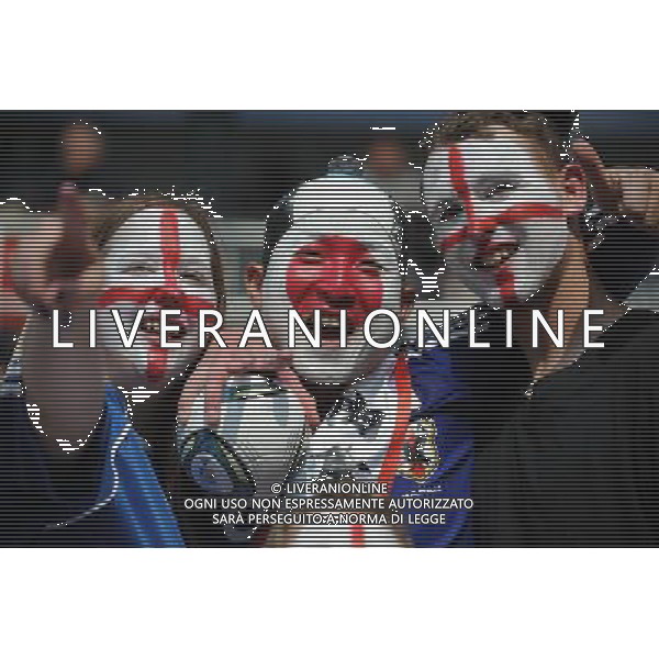 (110706) -- AUGSBURG, July 6, 2011 () -- Supporters pose together before the 3rd round Group B match between England and Japan at the FIFA Women\'s World Cup Germany 2011 in Augsburg, Germany, July 5, 2011. (/Li Jundong)