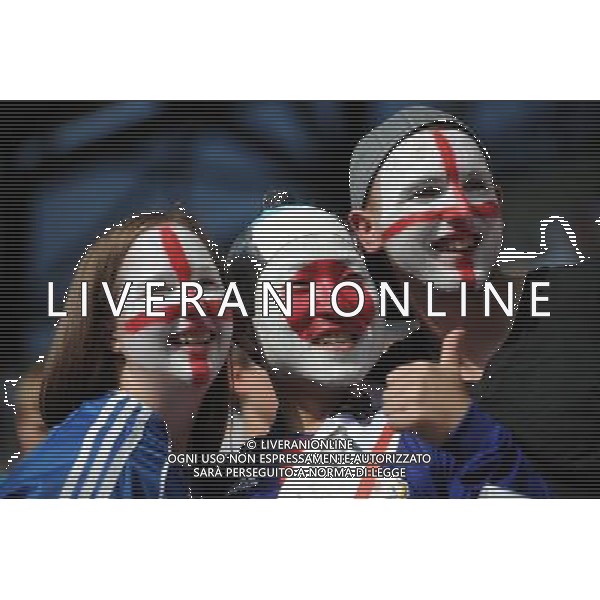 (110706) -- AUGSBURG, July 06, 2011 () -- Supporters pose together before the 3rd round Group B match between England and Japan at the FIFA Women\'s World Cup Germany 2011 in Augsburg, Germany, July 5, 2011. (/Li Jundong)