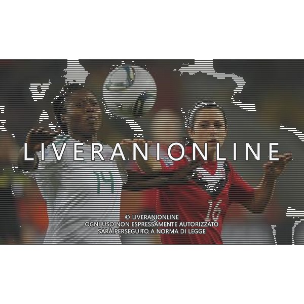 (110706) -- DRESDEN, July 6, 2011 () -- Nigeria\'s Faith Ikidi(L) fights with Canada\'s Jonelle Filigno during their Group A third round match at the 2011 FIFA Women\'s World Cup at the Rudolf-Harbig-Stadion in Dresden, Germany, July 5, 2011. Nigeria won the match 1-0. Either team advanced to the next round. (/Ding Xu)