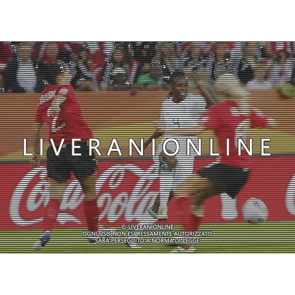 (110706) -- DRESDEN, July 6, 2011 () -- Nigeria\'s Perpetua Nkwocha (C) passes the ball during the Group A third round match against Canada at the 2011 FIFA Women\'s World Cup at the Rudolf-Harbig-Stadion in Dresden, Germany, July 5, 2011. Nigeria won the match 1-0. Either team advanced to the next round. (/Ding Xu)