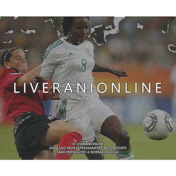 (110706) -- DRESDEN, July 6, 2011 () -- Nigeria\'s Ebere Orji (R) fights with Canada\'s Melissa Tancredi during their Group A third round match at the 2011 FIFA Women\'s World Cup at the Rudolf-Harbig-Stadion in Dresden, Germany, July 5, 2011. Nigeria won the match 1-0. Either team advanced to the next round. (/Ding Xu)