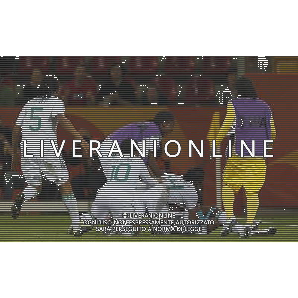 (110706) -- DRESDEN, July 6, 2011 () -- Nigeria\'s players celebrate after scoring during the Group A third round match against Canada at the 2011 FIFA Women\'s World Cup at the Rudolf-Harbig-Stadion in Dresden, Germany, July 5, 2011. Nigeria won the match 1-0. Neither team advanced to the next round. (/Ding Xu)