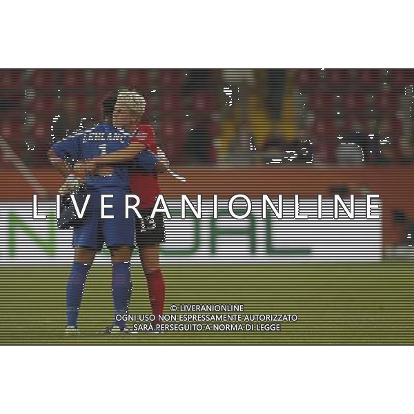 (110706) -- DRESDEN, July 6, 2011 () -- Canada\'s Sophie Schmidt (R) and goalkeeper Karina LeBlanc comfort each other after their Group A third round match against Nigeria at the 2011 FIFA Women\'s World Cup at the Rudolf-Harbig-Stadion in Dresden, Germany, July 5, 2011. Nigeria won the match 1-0. Either team advanced to the next round. (/Ding Xu)