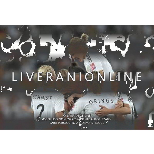 (110706) -- MOENCHENGLADBACH, July 6, 2011 () -- Players of Germany celebrate for a goal during the third round Group A match at the FIFA Women\'s World Cup Germany 2011 in Moenchengladbach, Germany, July 5, 2011. Germany won 4-2. (/Wu Wei)