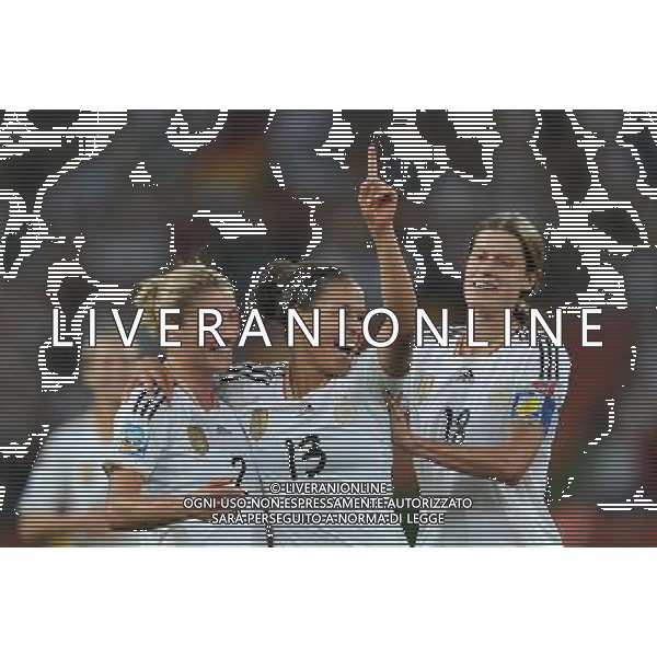 (110706) -- MOENCHENGLADBACH, July 6, 2011 () -- Celia Okoyino Da Mbabi (C) of Germany celebrates for her goal with her teammates during the third round Group A match at the FIFA Women\'s World Cup Germany 2011 in Moenchengladbach, Germany, July 5, 2011. Germany won 4-2. (/Wu Wei)