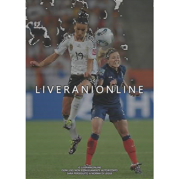 (110706) -- MOENCHENGLADBACH, July 6, 2011 () -- Fatmire Bajramaj (L) of Germany vies with Laure Boulleau of France during the third round Group A match at the FIFA Women\'s World Cup Germany 2011 in Moenchengladbach, Germany, July 5, 2011. Germany won 4-2. (/Wu Wei)