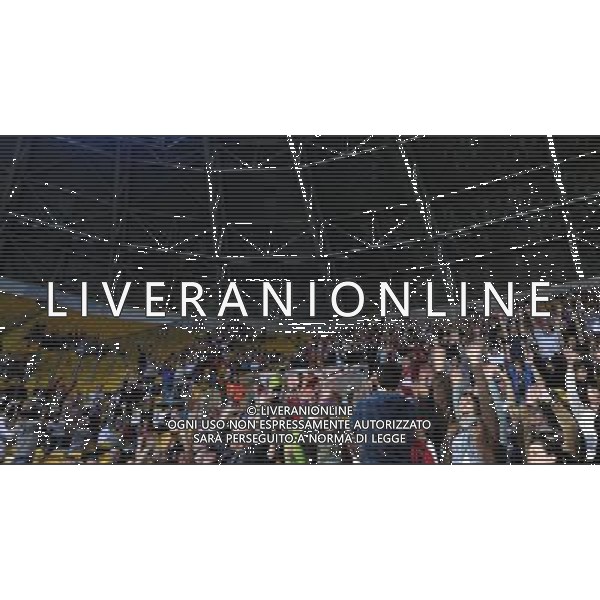 (110706) -- DRESDEN, July 6, 2011 () -- Fans amuse themselves when the power is off during the Group A third round match between Canada and Nigeria at the 2011 FIFA Women\'s World Cup at the Rudolf-Harbig-Stadion in Dresden, Germany, July 5, 2011. (/Ding Xu)