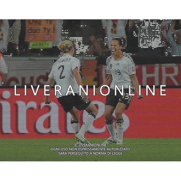 (110706) -- MOENCHENGLADBACH, July 6, 2011 () -- Celia Okoyino da Mbabi (R) of Germany celebrates her goal during the third round Group A match between France and Germany at the FIFA Women\'s World Cup Germany 2011 in Moenchengladbach, Germany, July 5, 2011. Germany won the match 4-2.(/Ma Ning)