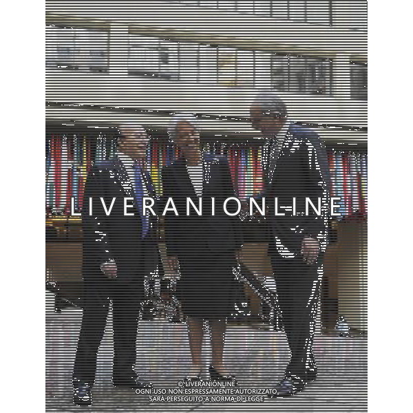 (110705) -- WASHINGTON, July 5, 2011 () -- Christine Lagarde (C), newly appointed Managing Director of the International Monetary Fund (IMF), is welcomed by Deputy Director John Lipsky (R) and Shakour Shaalan, Dean of the Executive Board, after arriving for her first day of work at IMF headquarters in Washington, D.C., July 5, 2011. (/Zhang Jun) (lyi)