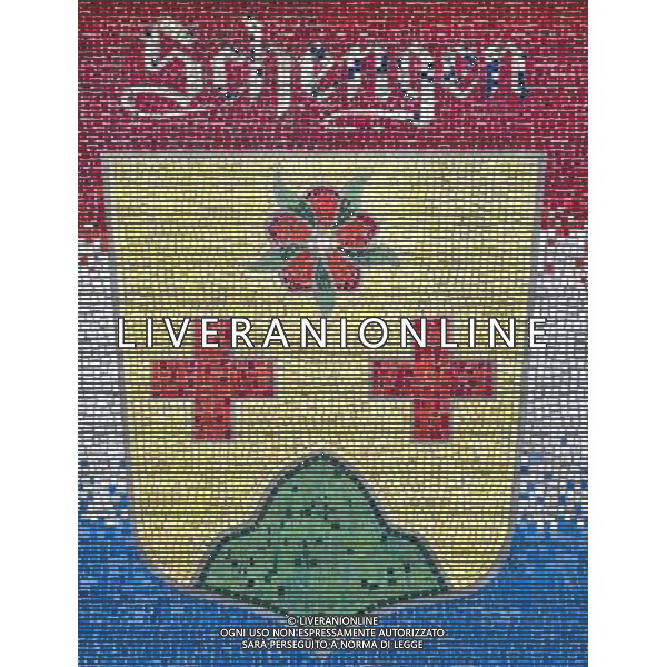 Crest of Schengen, Luxembourg on 2011-07-04 - The Schengen Area comprises the territories of twenty-five European countries that have implemented the Schengen Agreement signed in the town of Schengen, Luxembourg, in 1985. The Schengen Area operates very much like a single state for international travel with border controls for those travelling in and out of the area, but with no internal border controls