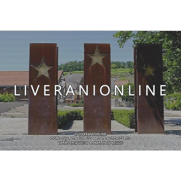 Symbolic statue with European Stars Schengen, Luxembourg on 2011-07-04 - The Schengen Area comprises the territories of twenty-five European countries that have implemented the Schengen Agreement signed in the town of Schengen, Luxembourg, in 1985. The Schengen Area operates very much like a single state for international travel with border controls for those travelling in and out of the area, but with no internal border controls