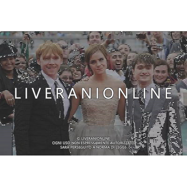 (L-R) Rupert Grint, Emma Watson and Daniel Radcliffe attend the World Premiere of Harry Potter and The Deathly Hallows - Part 2 at Trafalgar Square on July 7, 2011 in London, England.