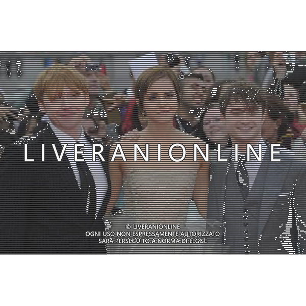 (L-R) Rupert Grint, Emma Watson and Daniel Radcliffe attend the World Premiere of Harry Potter and The Deathly Hallows - Part 2 at Trafalgar Square on July 7, 2011 in London, England.