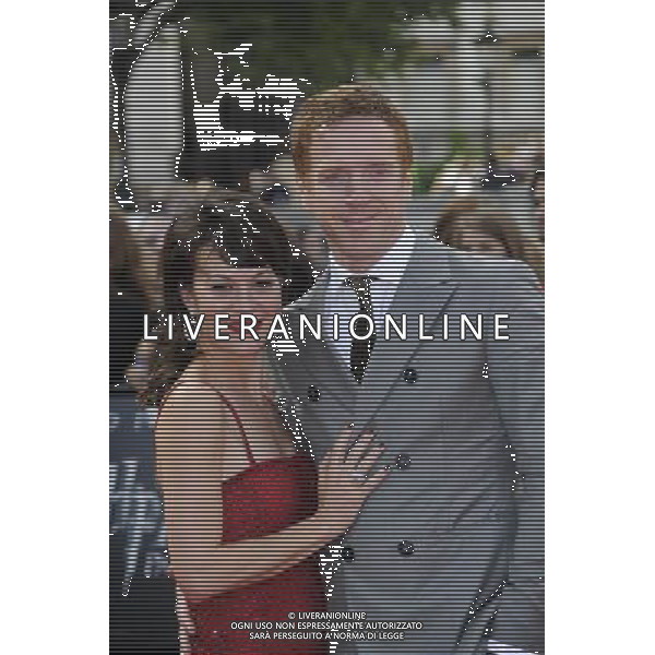Actors Damian Lewis (L) and Helen McCrory arrive at the World Premiere of \'Harry Potter And The Deathly Hallows Part 2\' in Trafalgar Square on July 7, 2011 in London, England.