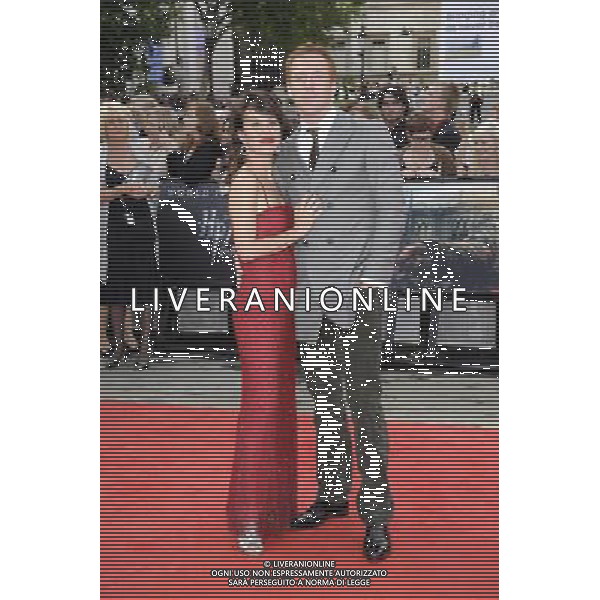Actors Damian Lewis (L) and Helen McCrory arrive at the World Premiere of \'Harry Potter And The Deathly Hallows Part 2\' in Trafalgar Square on July 7, 2011 in London, England.