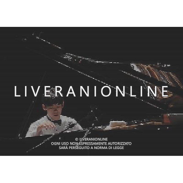 (110710) -- ROME, July 10, 2011 -- Chinese young pianist Zhang Haochen performs during a solo concert at the Hadrian\'s Villa in Tivoli, a suburban town of Rome, Italy, July 9, 2011. Wang Qingqin)