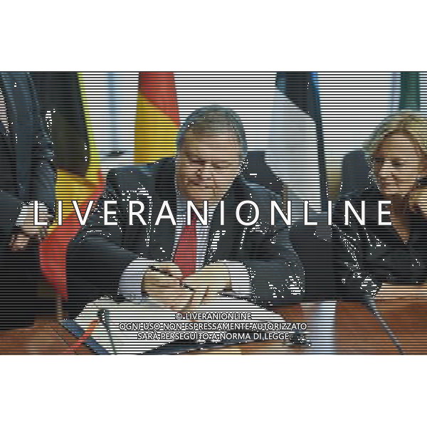 Greece\'s Finance Minister Evangelos Venizelos signing the treaty establishing the European Stability Mechanism ahead of a euro zone finance ministers meeting in in Brussels, Belgium on 2011-07-11