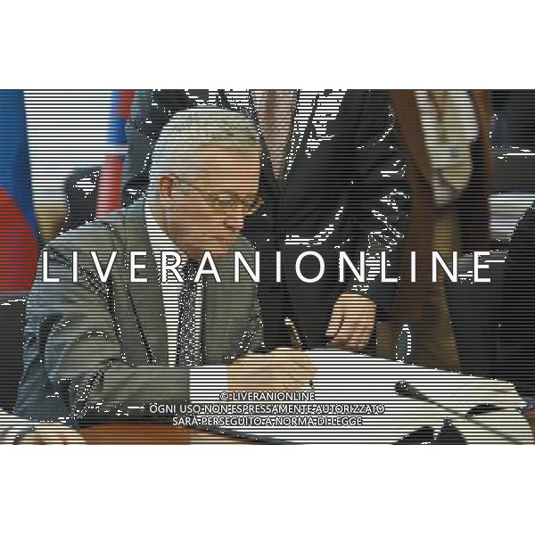 Italian Finance Minister Giulio Tremonti signing the treaty establishing the European Stability Mechanism ahead of a euro zone finance ministers meeting in in Brussels, Belgium on 2011-07-11
