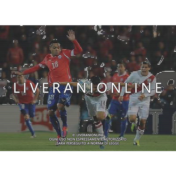 MENDOZA, July 12, 2011 Gonzalo Jara (L, front) of Chile fights for the ball against Raul Ruidiaz (R) of Peru in the group match of Copa America 2011 in Mendoza, Argentina, on July 12, 2011. (/Nicolas Celaya) (py)