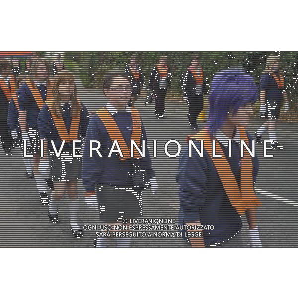 Young girls, members of the Junior Women\'s Loyal Orange Lodge of the Orange Order on parade in 12th July celebrations in Killylea County Armagh Northern Ireland