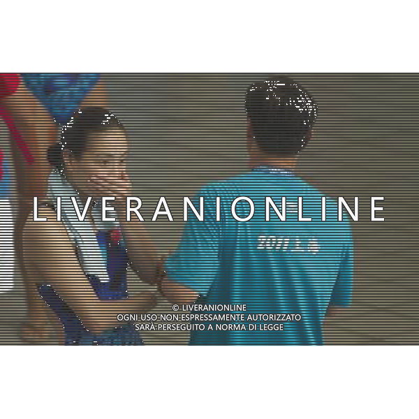(110716) -- SHANGHAI, July 16, 2011 () -- Wu Minxia (L) of China is congratulated by her coach after the final of the women\'s 3m synchronized springboard diving event at the 14th FINA World Championships in Shanghai, east China, July 16, 2011. Wu Minxia and He Zi of China claimed the title with 356.40 points. (/Fei Maohua) (zgp)