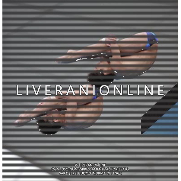 (110717) -- SHANGHAI, July 17, 2011 () -- Qiu Bo/Huo Liang (R) of China compete in the final of the men\'s 10m synchronized platform diving event at the 14th FINA World Championships in Shanghai, east China, July 17, 2011. Qiu Bo/Huo Liang of China claimed the title with 480.03 points. (/Yang Zongyou)(zgp)