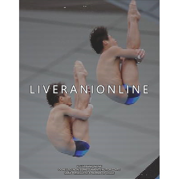(110717) -- SHANGHAI, July 17, 2011 () -- Qiu Bo/Huo Liang (R) of China compete in the final of the men\'s 10m synchronized platform diving event at the 14th FINA World Championships in Shanghai, east China, July 17, 2011. Qiu Bo/Huo Liang of China claimed the title with 480.03 points. (/Yang Zongyou)(zgp)