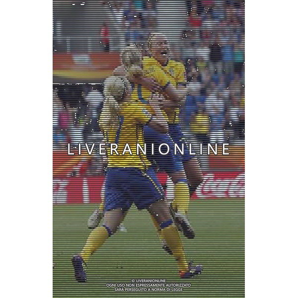 (110716) -- SINSHEIM, July 16, 2011 () -- Sweden\'s Marie Hammarstrom (C) celebrates her goal with teammates during the third place final match between Sweden and France at the 2011 FIFA Women\'s World Cup in Sinsheim, Germany, July 16, 2011. Sweden beat France 2-1 and claimed the third place of the 2011 FIFA Women\'s World Cup. (/Ding Xu) (zw)