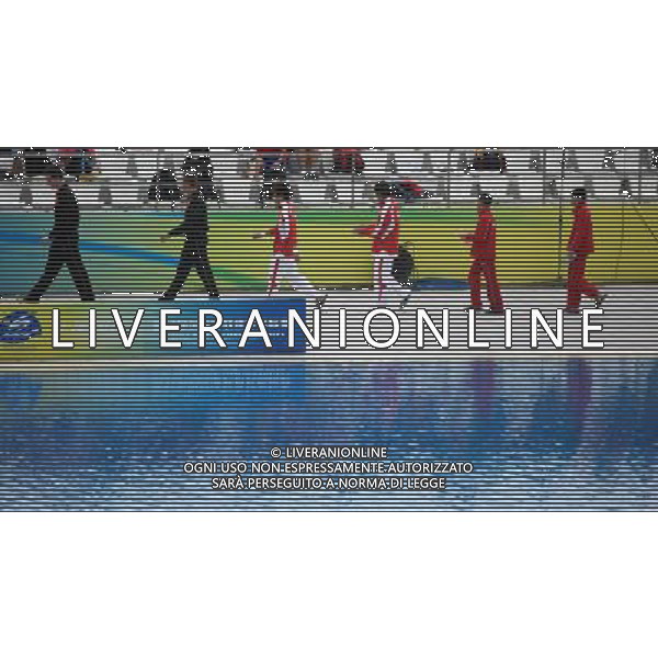 (110717) -- SHANGHAI, July 17, 2011 () -- Qiu Bo (3rd R) /Huo Liang (3rd L) of China walk by the diving pool in the preliminary round of the men\'s 10m synchronized platform diving event at the 14th FINA World Championships in Shanghai, east China, July 17, 2011. Qiu Bo/Huo Liang ranked the 1st place with 477.96 points. (/Li Ming)