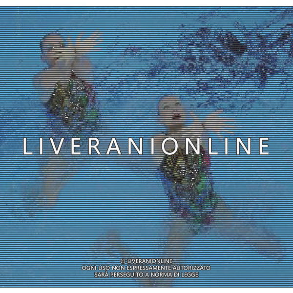 SHANGHAI, July 18, 2011 Natalia Ishchenko/Svetlana Romashina of Russia compete in the final of the technical duets of synchronized swimming event at the 14th FINA World Championships in Shanghai, east China, July 18, 2011. The Russian duet claimed the title with 98.200 points. (/Yang Zongyou) (zgp)