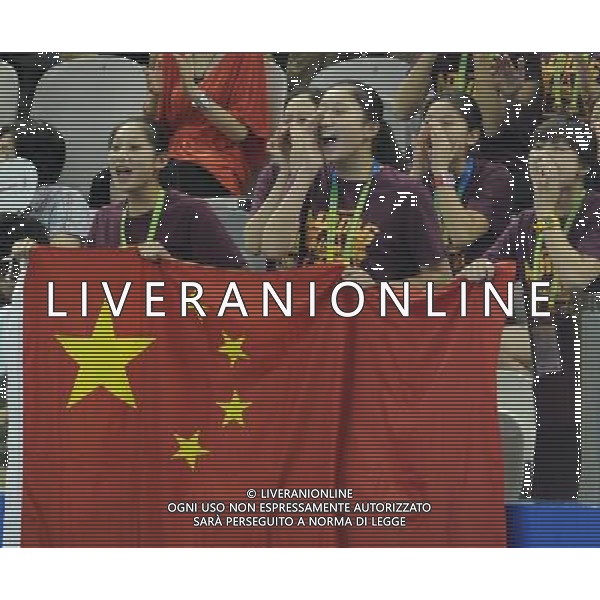 SHANGHAI, July 18, 2011 Chinese spectators cheer for Huang Xuechen and Liu Ou of China during the final of the technical duets of synchronized swimming event at the 14th FINA World Championships in Shanghai, east China, July 18, 2011. The Chinese duet grabbed the silver medal with 96.500 points. (/Wang Yuguo) (zgp)