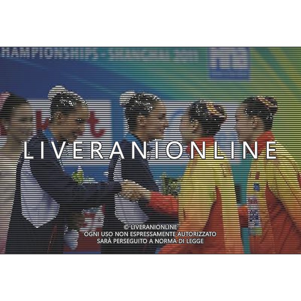 SHANGHAI, July 18, 2011 Huang Xuechen (1st R)/Liu Ou (2nd R) of China shake hands with Ona Carbonell and Andrea Fuentes of Spain at the awarding ceremony of the technical duets of synchronized swimming event at the 14th FINA World Championships in Shanghai, east China, July 18, 2011. The Chinese duet grabbed the silver medal with 96.500 points. The Spanish duet won the bronze medal with 95.400 points. (/Yang Zongyou) (zgp)