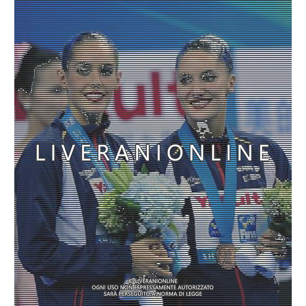 SHANGHAI, July 18, 2011 Ona Carbonell/Andrea Fuentes of Spain attend the awarding ceremony of the technical duets of synchronized swimming event at the 14th FINA World Championships in Shanghai, east China, July 18, 2011. The Spanish duet won the bronze medal with 95.400 points. (/Yang Zongyou) (zgp)