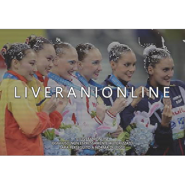 SHANGHAI, July 18, 2011 Huang Xuechen /Liu Ou of China (L), Natalia Ishchenko/Svetlana Romashina of Russia (C), Ona Carbonell/Andrea Fuentes of Spain (R) attend the awarding ceremony of the technical duets of synchronized swimming event at the 14th FINA World Championships in Shanghai, east China, July 18, 2011. The Russian duet claimed the title with 98.200 points. The Chinese duet grabbed the silver medal with 96.500 points. The Spanish duet won the bronze medal with 95.400 points. (/Yang Zongyou) (zgp)
