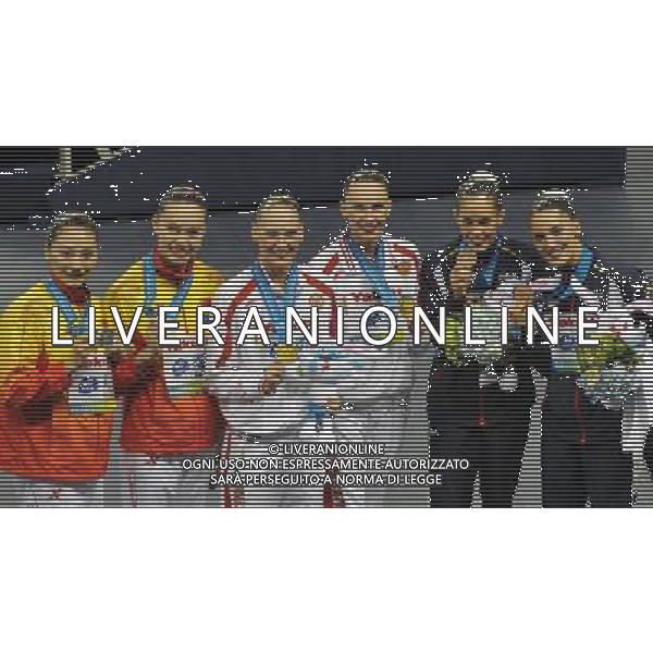 SHANGHAI, July 18, 2011 Huang Xuechen/Liu Ou of China (L), Natalia Ishchenko/Svetlana Romashina of Russia (C), Ona Carbonell/Andrea Fuentes of Spain (R) attend the awarding ceremony of the technical duets of synchronized swimming event at the 14th FINA World Championships in Shanghai, east China, July 18, 2011. The Russian duet claimed the title with 98.200 points. The Chinese duet grabbed the silver medal with 96.500 points. The Spanish duet won the bronze medal with 95.400 points. (/Wang Yuguo) (zgp)