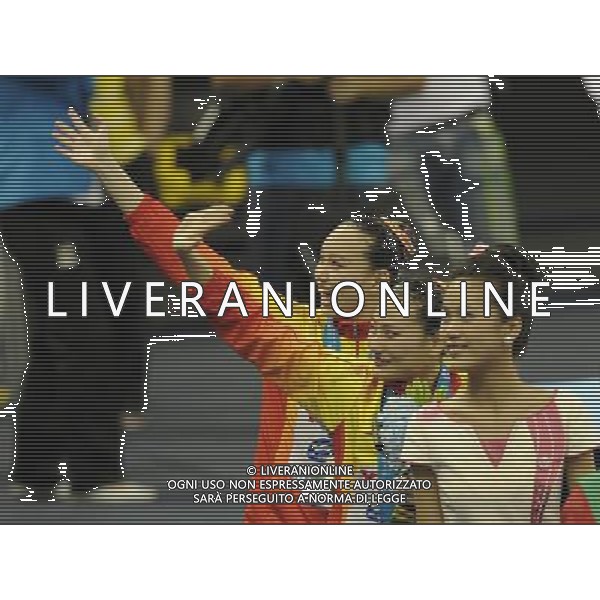 SHANGHAI, July 18, 2011 Huang Xuechen (3rd R) and Liu Ou (2nd R) of China wave to spectators at the awarding ceremony of the technical duets of synchronized swimming event at the 14th FINA World Championships in Shanghai, east China, July 18, 2011. The Chinese duet grabbed the silver medal with 96.500 points. (/Wang Yuguo) (zgp)