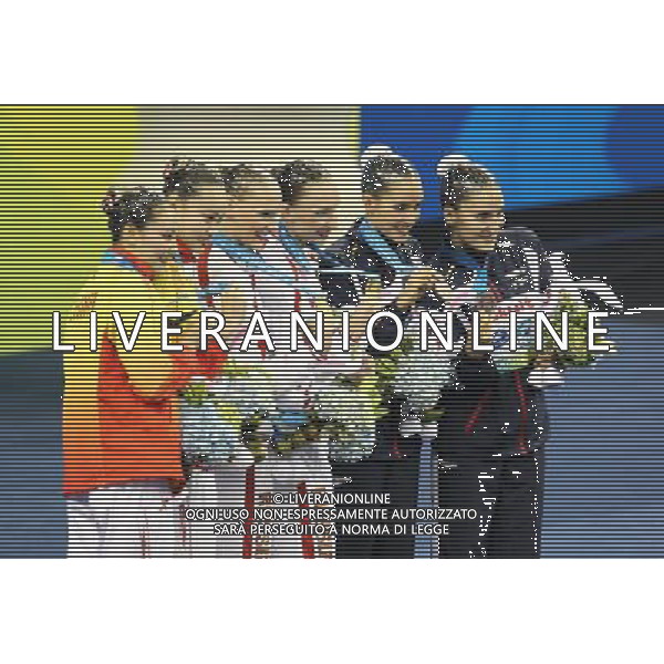 SHANGHAI, July 18, 2011 Huang Xuechen/Liu Ou of China (L), Natalia Ishchenko/Svetlana Romashina of Russia (C), Ona Carbonell/Andrea Fuentes of Spain (R) attend the awarding ceremony of the technical duets of synchronized swimming event at the 14th FINA World Championships in Shanghai, east China, July 18, 2011. The Russian duet claimed the title with 98.200 points. The Chinese duet grabbed the silver medal with 96.500 points. The Spanish duet won the bronze medal with 95.400 points. (/Ren Long) (zgp)